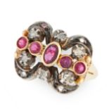 A RUBY AND DIAMOND RING set with a central row of round and oval cut rubies, in a scrolling border