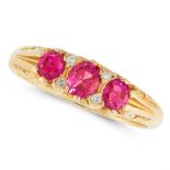 A RUBY AND DIAMOND DRESS RING in 18ct yellow gold, set with a trio of graduated cushion cut rubies