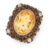 A CITRINE AND DIAMOND DRESS RING in 18ct yellow gold and silver, set with an oval cut citrine in a