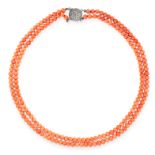 A TWO ROW CORAL BEAD NECKLACE in silver, comprising of two rows of polished coral beads, set on a