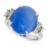 A BURMA NO HEAT STAR SAPPHIRE AND DIAMOND RING in 18ct white gold, set with an oval cabochon blue