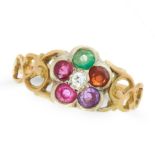 A GEMSET REGARD RING in yellow gold and silver, set with a cluster of round cut ruby, emerald,