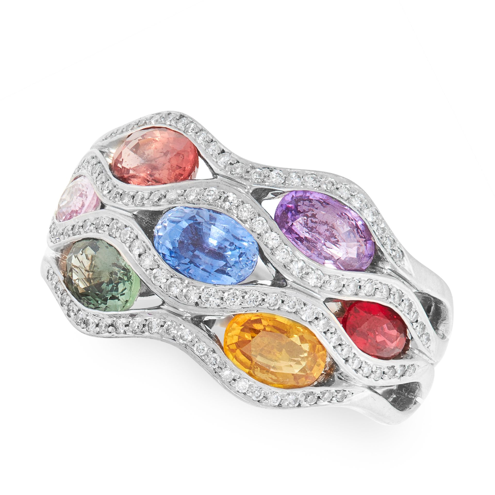 A MULTI COLOUR SAPPHIRE AND DIAMOND RING, WASKOLL in 18ct white gold, the bombe face is set oval cut