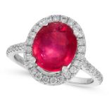 A RUBY AND DIAMOND DRESS RING in 18ct white gold, set with an oval cut ruby of 4.11 carats, in a