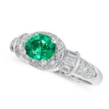 AN EMERALD AND DIAMOND DRESS RING in platinum, set with an oval cut emerald of 0.88 carats and round