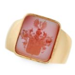 AN ANTIQUE HARDSTONE INTAGLIO SEAL / SIGNET BISHOP'S RING in yellow gold, the face set with a