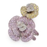 A PINK SAPPHIRE, YELLOW SAPPHIRE AND DIAMOND RING comprising of two roses set with round cut