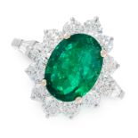 AN EMERALD AND DIAMOND CLUSTER RING in 18ct white gold, set with an oval cut emerald of 3.39 carats,