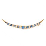AN ANTIQUE SAPPHIRE AND DIAMOND CRESCENT MOON BROOCH in yellow gold, in the form of a crescent moon,