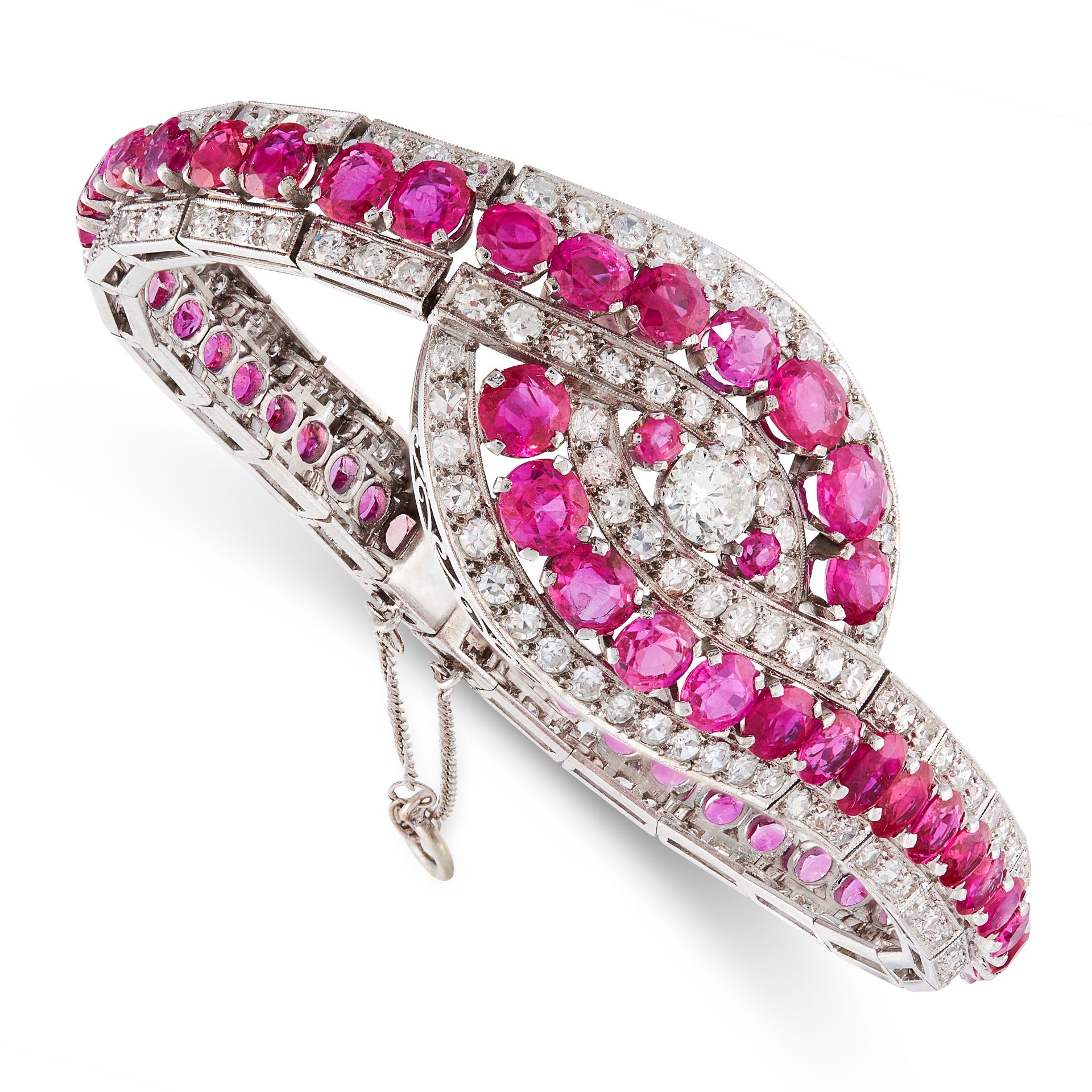 AN EXCEPTIONAL BURMA NO HEAT RUBY AND DIAMOND BRACELET set with a central round cut diamond within