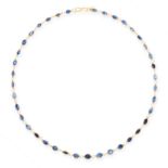 A SAPPHIRE NECKLACE in yellow gold, comprising a single row of thirty-nine oval and pear cut