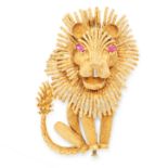 A VINTAGE RUBY LION BROOCH in 18ct yellow gold, designed as a seated lion with textured decoration
