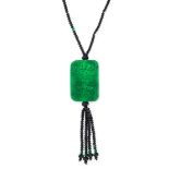 A JADE AND ONYX BEAD PENDANT NECKLACE comprising of a single row of polished onyx and jade beads,