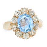 AN ANTIQUE SAPPHIRE AND DIAMOND CLUSTER RING in yellow gold, set with an oval cut sapphire of 2.31