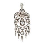 AN ANTIQUE DIAMOND PENDANT, 19TH CENTURY in yellow gold and silver, the scrolling circular body