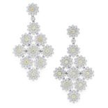 A PAIR OF YELLOW AND WHITE DIAMOND DAISY DROP EARRINGS in 18ct white gold, each earring is set a