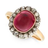 AN ANTIQUE GARNET AND DIAMOND DRESS RING in 18ct yellow gold and silver, set with an oval cabochon