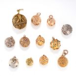 A MIXED LOT OF TWELVE ANTIQUE POMANDER PENDANTS in yellow gold and silver, some with engraved