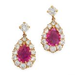 A PAIR OF BURMA NO HEAT RUBY AND DIAMOND EARRINGS in 18ct yellow gold, each set with a pear cut