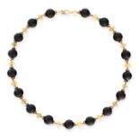 AN ONYX, OPAL AND DIAMOND NECKLACE in 18ct yellow gold, comprising a single row of seventeen