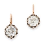 A PAIR OF ANTIQUE DIAMOND EARRINGS in yellow gold and silver, each set with an old European cut