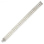 A PEARL AND DIAMOND BRACELET, EARLY 20TH CENTURY in platinum, comprising three rows of pearls
