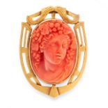 AN ANTIQUE CARVED CORAL CAMEO BROOCH, 19TH CENTURY in yellow gold, of shield design, set with a