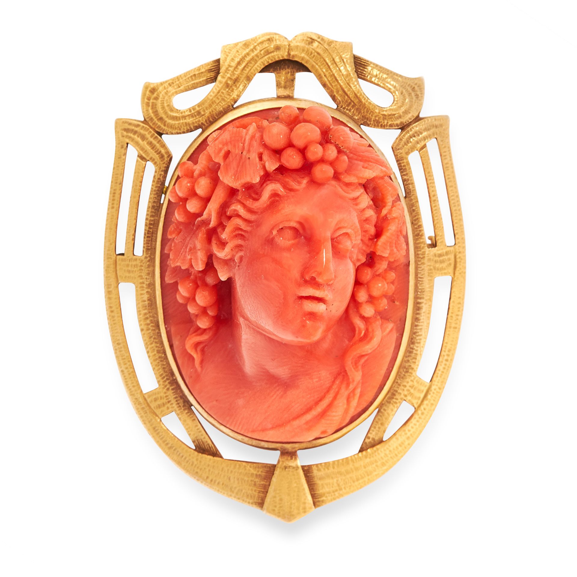 AN ANTIQUE CARVED CORAL CAMEO BROOCH, 19TH CENTURY in yellow gold, of shield design, set with a