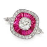 A DIAMOND AND RUBY DRESS RING in platinum, of target design, set with an old cut diamond of 0.58