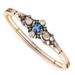 AN ANTIQUE SAPPHIRE, DIAMOND AND PINK DIAMOND BANGLE in yellow gold and silver, set with a cushion