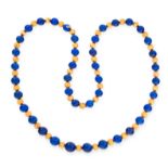 A LAPIS LAZULI BEAD NECKLACE comprising a single row of forty-one polished lapis lazuli beads