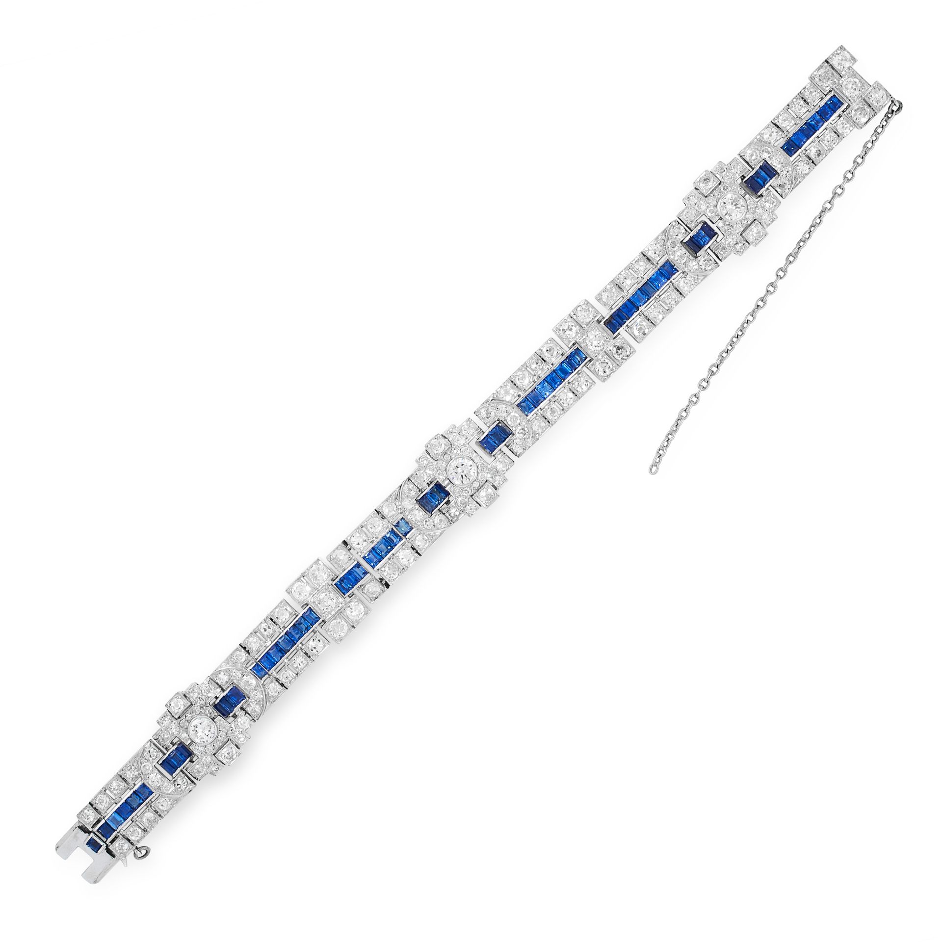 A SAPPHIRE AND DIAMOND BRACELET, CIRCA 1950 set with a trio of principal round cut diamonds accented