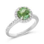 A GREEN TOURMALINE AND DIAMOND RING in 18ct white gold, set with a 1.60 carat octagonal cut green