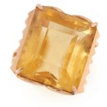 A RETRO CITRINE DRESS RING in yellow gold, set with an emerald cut citrine, marked indistinctly,