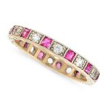 A VINTAGE GEMSET ETERNITY BAND RING comprising a single row of alternating step cut red stones and