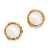A PAIR OF VINTAGE PEARL CLIP EARRINGS in yellow gold, each set with a half pearl of 14.0mm within