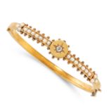 AN ANTIQUE PEARL AND DIAMOND BANGLE in 15ct yellow gold, the body applied with a central circular