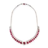 A RUBY AND DIAMOND NECKLACE set with a row of twenty-three graduated oval cabochon rubies