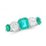 AN EMERALD AND DIAMOND DRESS RING in platinum, set with a trio of graduated step cut emeralds