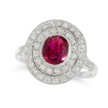 A RUBY AND DIAMOND DRESS RING in platinum, set with an oval cut ruby of 1.23 carats within a