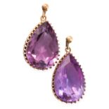 A PAIR OF ANTIQUE AMETHYST EARRINGS in yellow gold, each set with a pear cut amethyst suspended