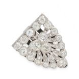 A DIAMOND CLIP BROOCH, CIRCA 1940 in platinum, of shield design, set with a trio of principal old