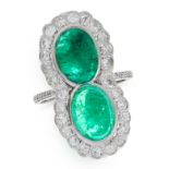 AN EMERALD AND DIAMOND DRESS RING comprising of two ovals, each set with a cabochon emerald of 4.