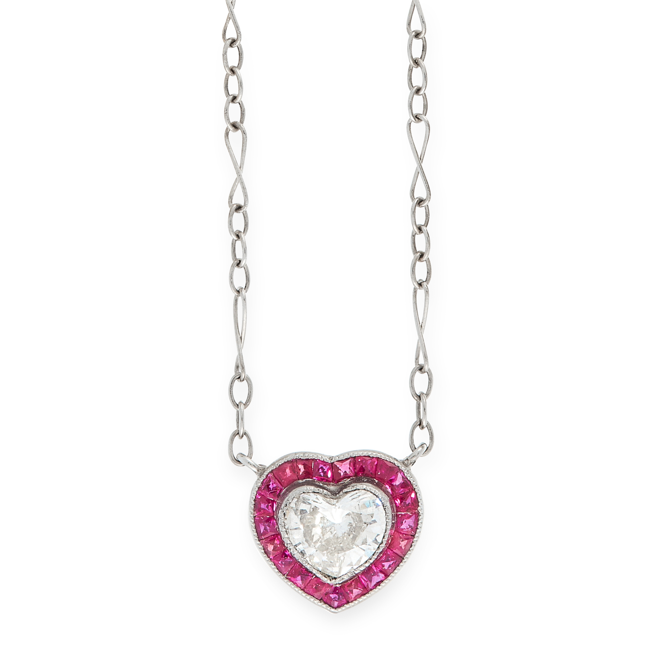 A DIAMOND AND RUBY PENDANT NECKLACE in white gold, set with a heart shaped brilliant cut diamond