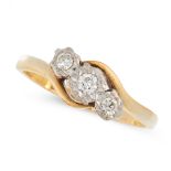 A DIAMOND THREE STONE RING in 18ct yellow gold, the twisted shank is set with a trio of round cut