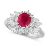 A RUBY AND DIAMOND DRESS RING in platinum, set with an oval cut ruby of 1.15 carats and marquise and