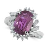 A PINK SAPPHIRE AND DIAMOND DRESS RING in platinum, set with an oval cut pink sapphire of 3.90