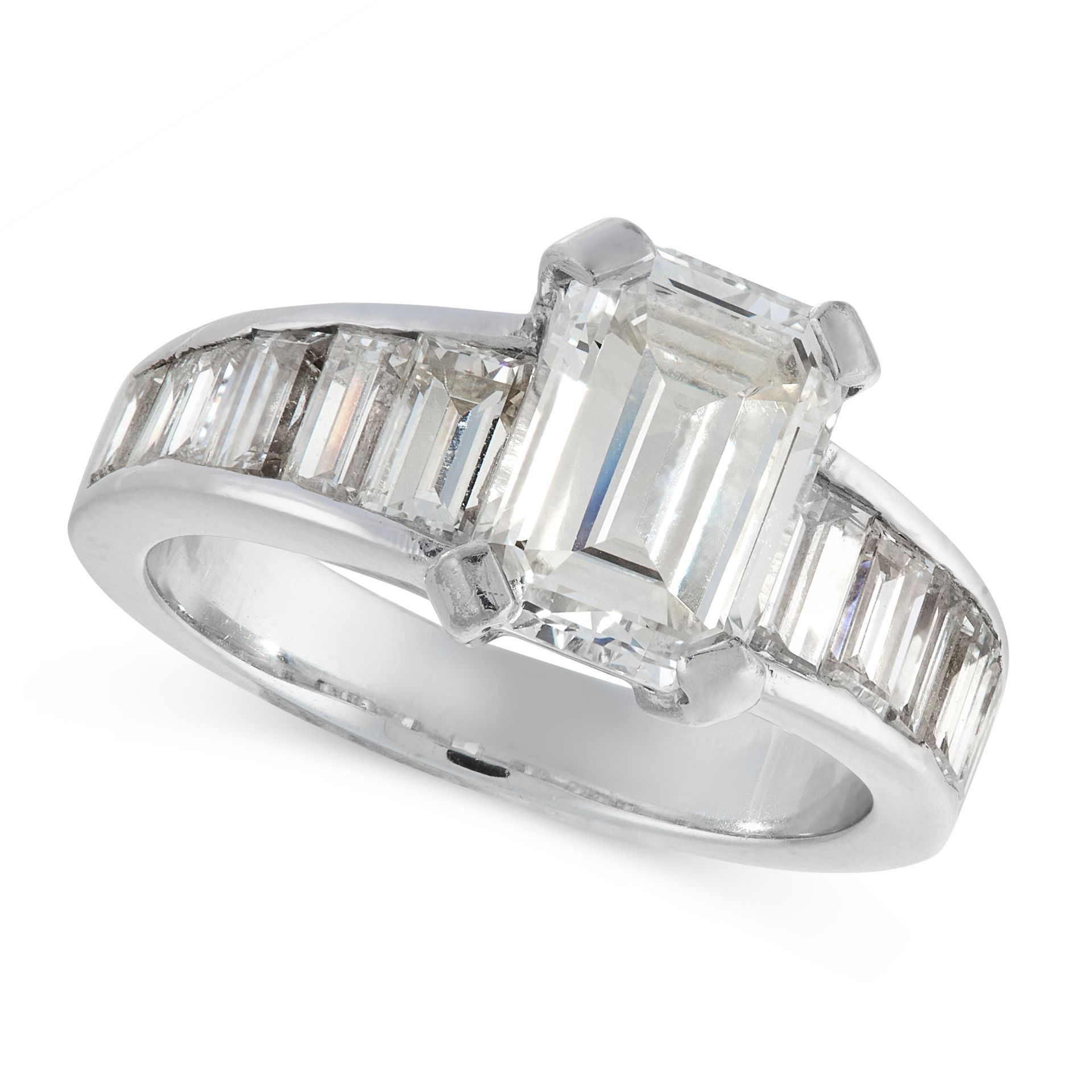 A DIAMOND DRESS RING set with an emerald cut diamond of 2.38 carats with further baguette cut