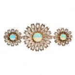 AN ANTIQUE OPAL AND DIAMOND BROOCH in yellow gold and silver, formed of a trio of flower motifs,