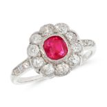 A RUBY AND DIAMOND DRESS RING set with a cushion cut ruby of 0.70 carats within a border of ten